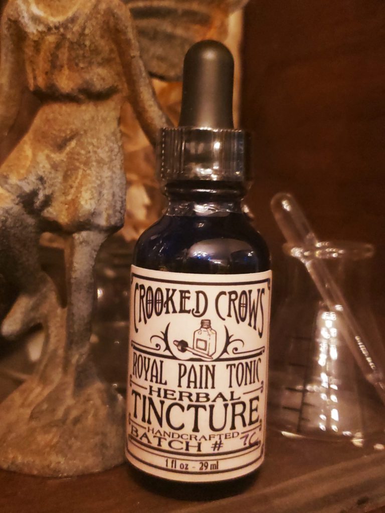 Amber dropper bottle of Crooked Crows herbal tincture